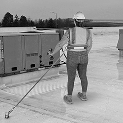 Image of ProductInUse. Back orientation. Travel-Limiting Lanyards. Tethering Travel-Limiting Lanyards.