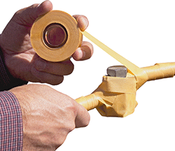 Image of ProductInUse. Top orientation. Electrical Tape. Puncture-Resistant Varnished Cotton Electrical Tape.