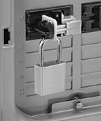 Image of ProductInUse. Lockout Shown Installed
(Padlock Not Included). Front orientation. 2 1/4" Overall Length. Tie-Bar Circuit Breaker Lockouts.