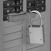 Image of ProductInUse. Shown Installed (Padlock Not Included). Front orientation. Lockouts. Clamp-On Circuit Breaker Lockouts, Style F.
