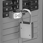Image of ProductInUse. Shown Installed (Padlock Not Included). Front orientation. Lockouts. Clamp-On Circuit Breaker Lockouts, Style B.