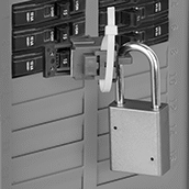 Image of ProductInUse. Lockout with Cable Tie Slot Shown Installed&nbsp;(Padlock
and Cable Tie Not Included). Front orientation. Lockouts. Clamp-On Circuit Breaker Lockouts, Style C.