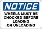 Image of Product. Front orientation. Signs. Plant and Shipping Dock Signs, Notice—Wheels Must Be Chocked Before Loading or Unloading (English).