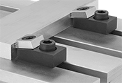 Image of ProductInUse. Front orientation. Fixture Clamps. T-Slot Side Clamps.