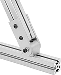 Image of ProductInUse. Inline with Straight Arms. Front orientation. T-Slotted Framing and Fittings. T-Slotted Framing Brackets, Heavy Duty Pivoting Brackets with Sleeve Bearings for Single Rails, Inline, Straight Arms.
