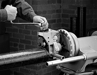 Image of ProductInUse. Electric Setup with Ridgid 300 Power Driver. Front orientation. Pipe Groovers. Forming Pipe Groovers.