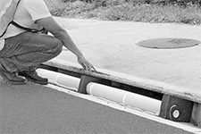 Image of ProductInUse. Front orientation. Storm Drain Filters. Curb-Style Storm Drain Filters.