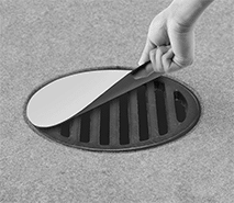 Image of ProductInUse. Front orientation. Spill-Control Drain Covers. Magnetic Spill-Control Drain Covers.