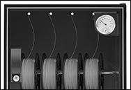 Image of ProductInUse. Filament Feed Ports. Front orientation. ZoomedIn view. Contains Border. Desiccators. Dehumidifying Cabinets, With Filament Feed Ports.