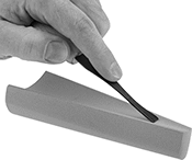 Image of ProductInUse. Shown in Use. Front orientation. Sharpening Stones. Handheld Sharpening Stones, Tapered Crescent Stone—For Curved Blade Edges, Single Grit.