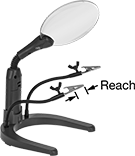 Image of Product. Front orientation. Contains Annotated. Spring Clamp Workholders. Two Spring Clamps with Adjustable Arms, Illumination and 2X Magnification and Round Base.