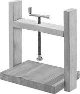 Image of ProductInUse. Clamp built into a press. Front orientation. Clamping Screws. Hole-Mount Screw Clamps.
