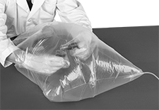 Image of ProductInUse. Back orientation. Contains MultipleImages. Glove Boxes and Bags. Glove Bags, Polyethylene.