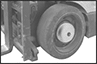 Image of ProductInUse. Mounted to Wheel Hub. Front orientation. Contains Border. Audible Alarms. Lift Truck Motion Bells.
