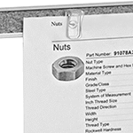 Image of ProductInUse. Clip-Head Push Pins Shown in Use. Front orientation. ZoomedIn view. Push Pins. Clip-Head Push Pins.