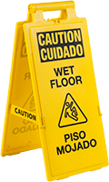 Image of Product. Front orientation. Signs. Fold-Flat Slip and Fall Prevention Signs, Caution—Wet Floor/Cuidado—Piso Mojado with Watch Your Step Symbol (English/Spanish)—Message on Front and Back.