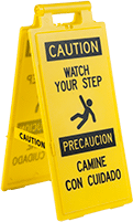 Image of Product. Front orientation. Signs. Fold-Flat Slip and Fall Prevention Signs, Caution—Watch Your Step/Precaucion—Camine Con Cuidado with Watch Your Step Symbol (English/Spanish)—Message on Front and Back.