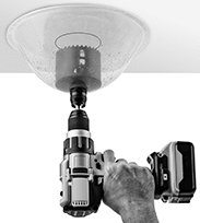 Image of ProductInUse. Debris Guard Shown with Hole Saw (Not Included). Front orientation. Hole Saw Debris Collectors.