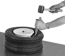 Image of ProductInUse. Step 1: Strike the hand-held bead breaker to release the grip between the tire and the rim.. Front orientation. Tire Changers. Bench Mount, For 4" to 12" Wheel Diameter Range.