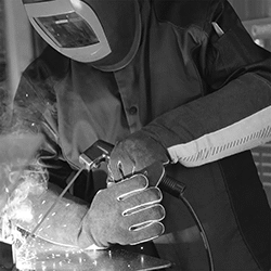 Image of ProductInUse. Padding Provides Added Protection Against Heat. Side1 orientation. Gloves. Stick Welding Gloves.